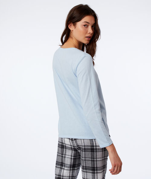T-shirt z napisem i pomponikami bleu.
